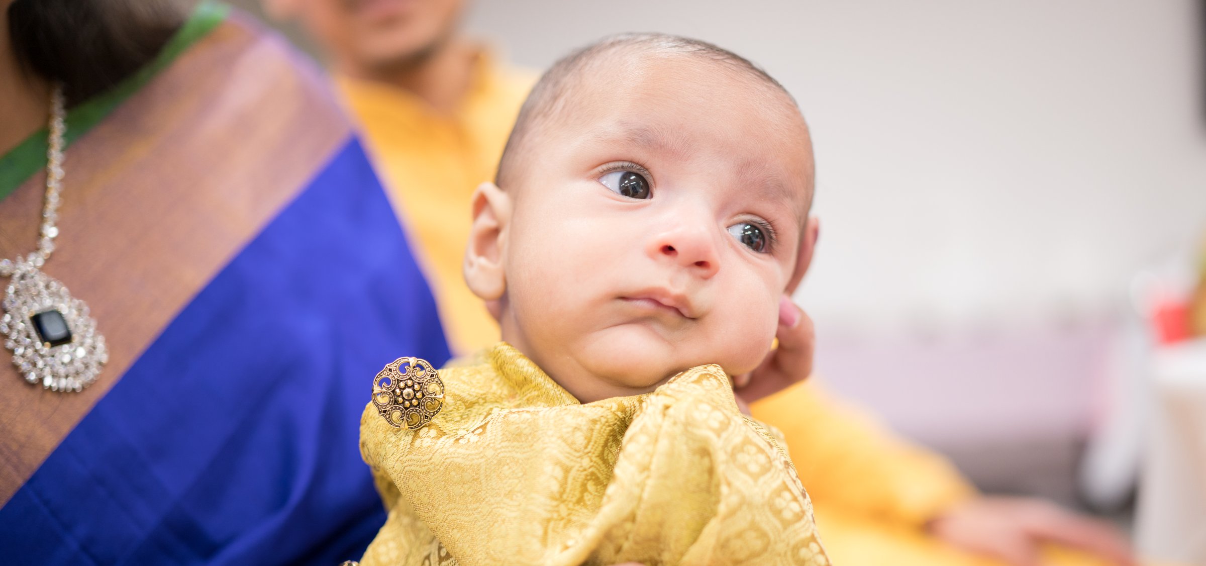 Hayana cradle ceremony newborn wide eyed close up