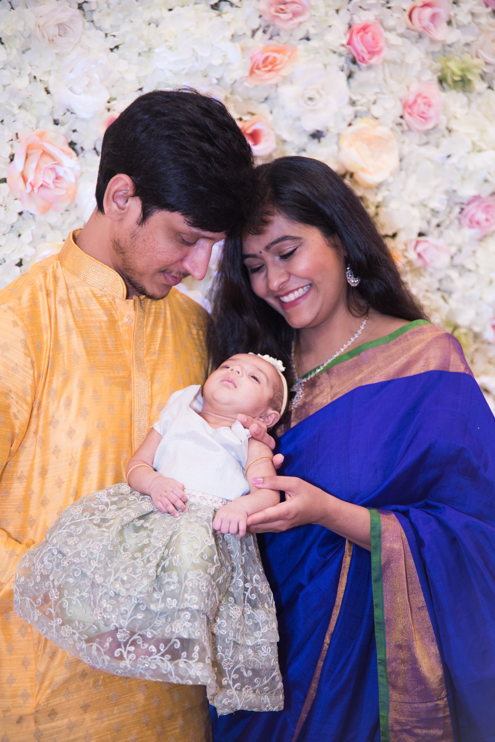 Hayana cradle ceremony parents cradling newborn