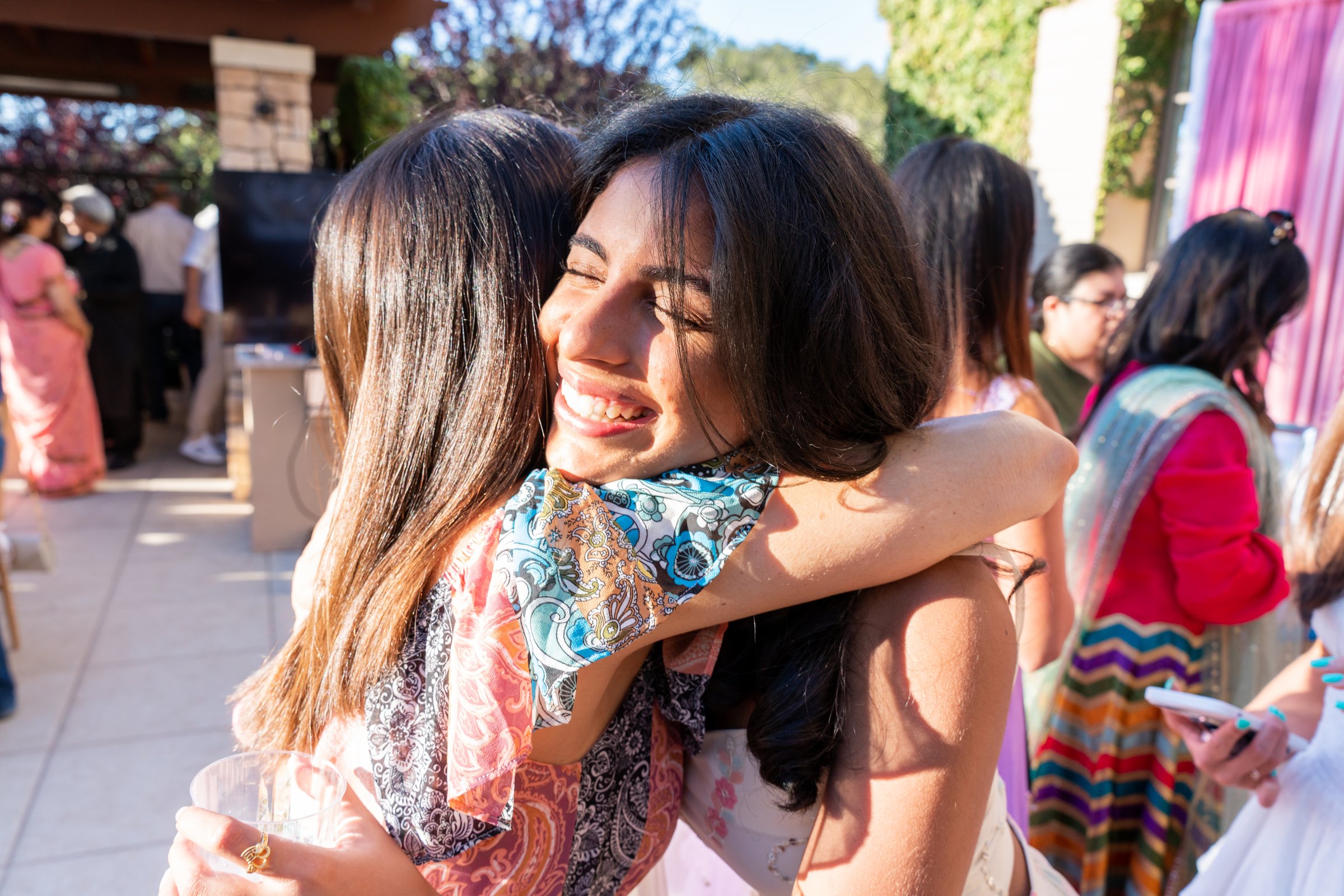 Sheen's graduation 2022 hug with eyes closed laughing
