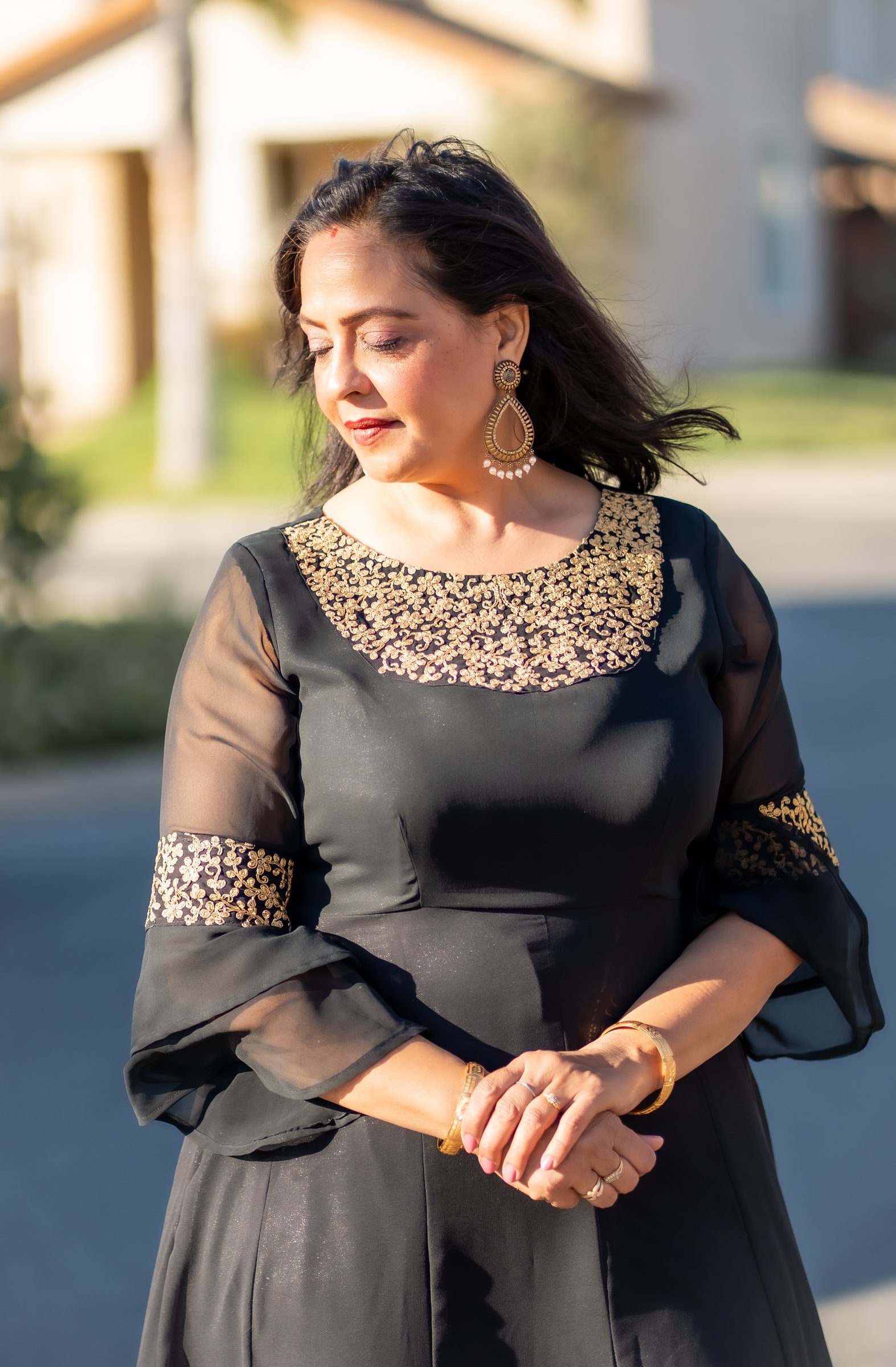 A backlit street portrait at a 50th birthday