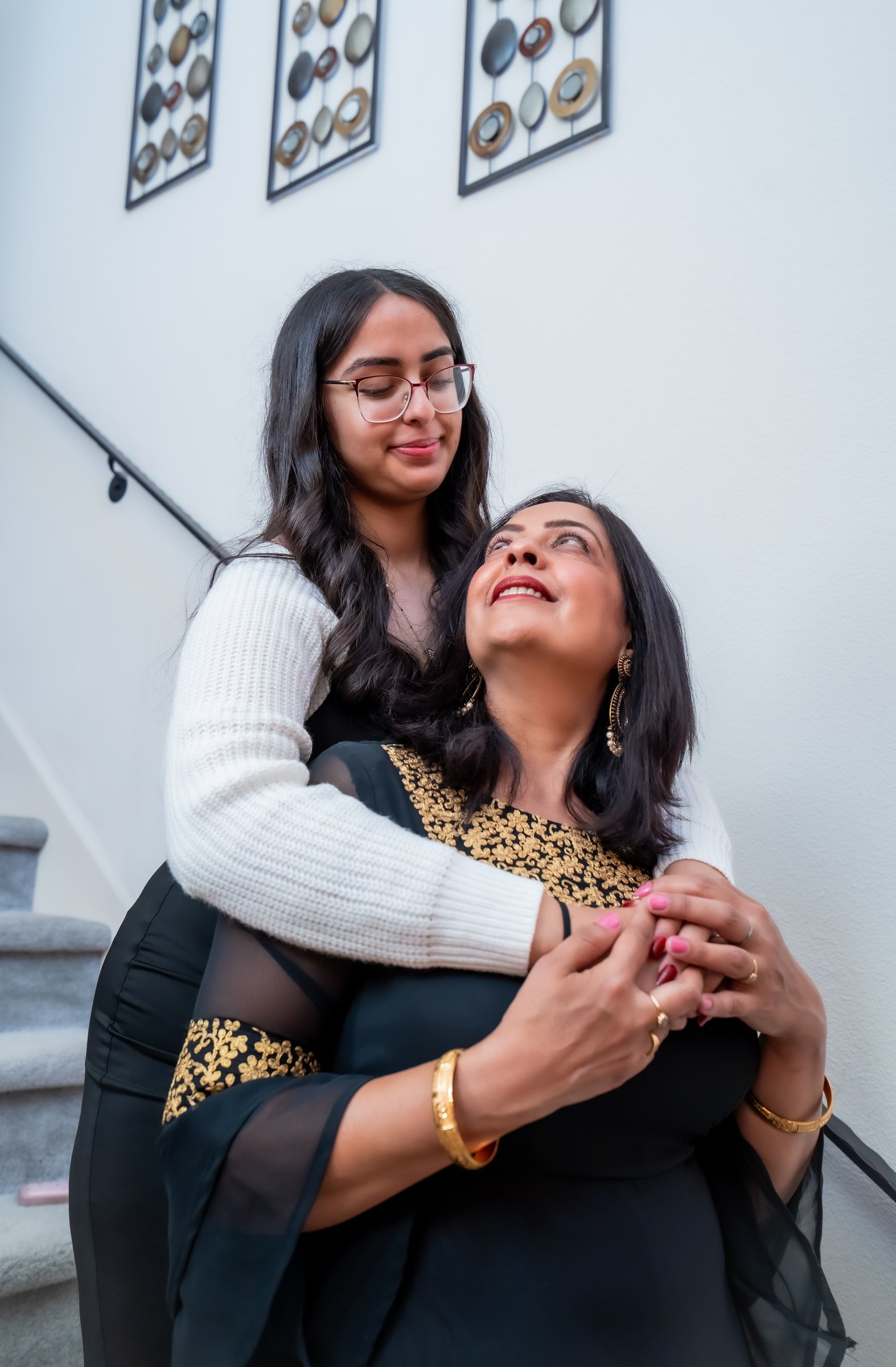 Upma's 50th birthday photos daughter hugging mother on stairs