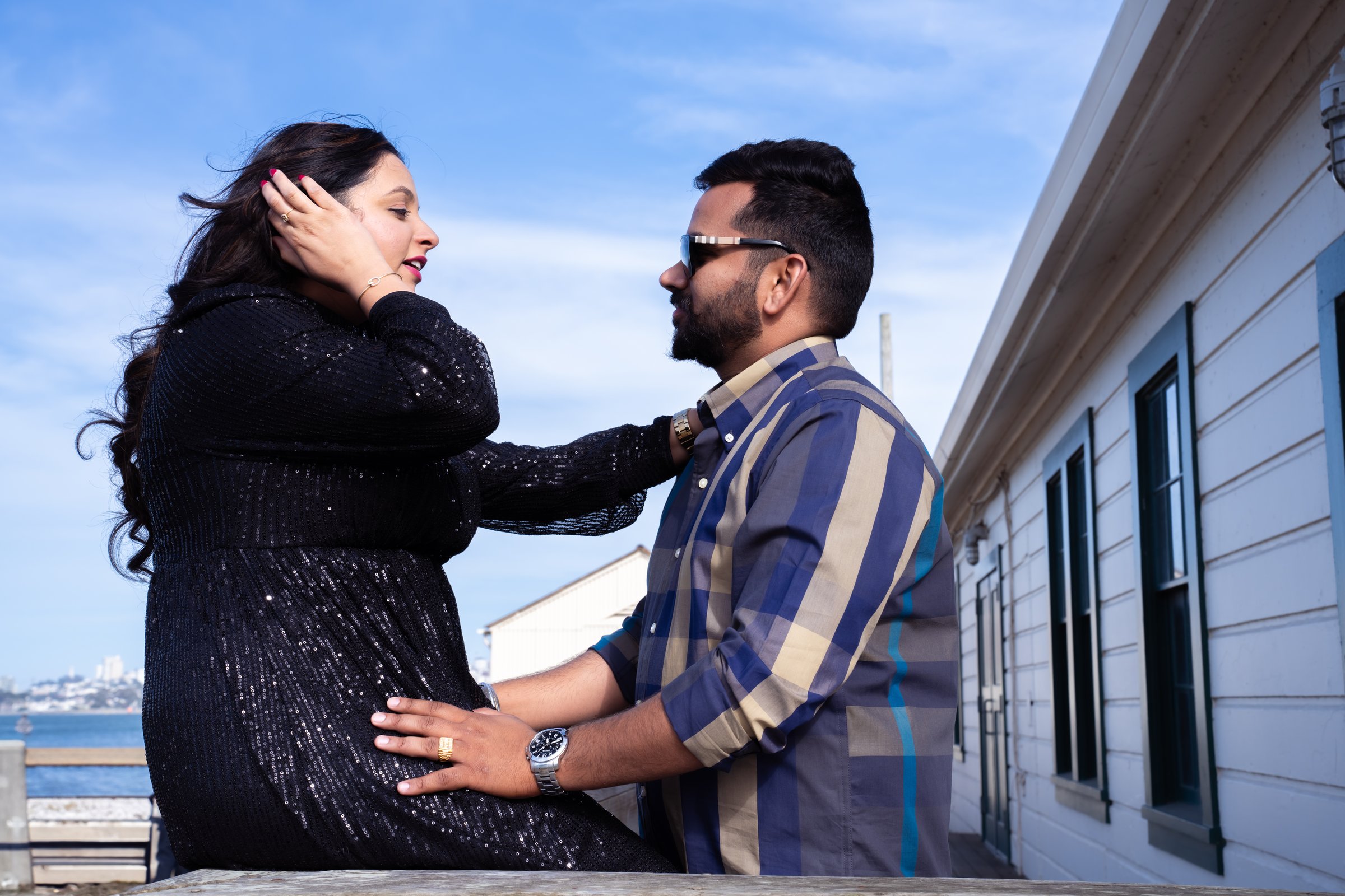 Harpreetandarun's engagement shoot pier profile hand in his hair