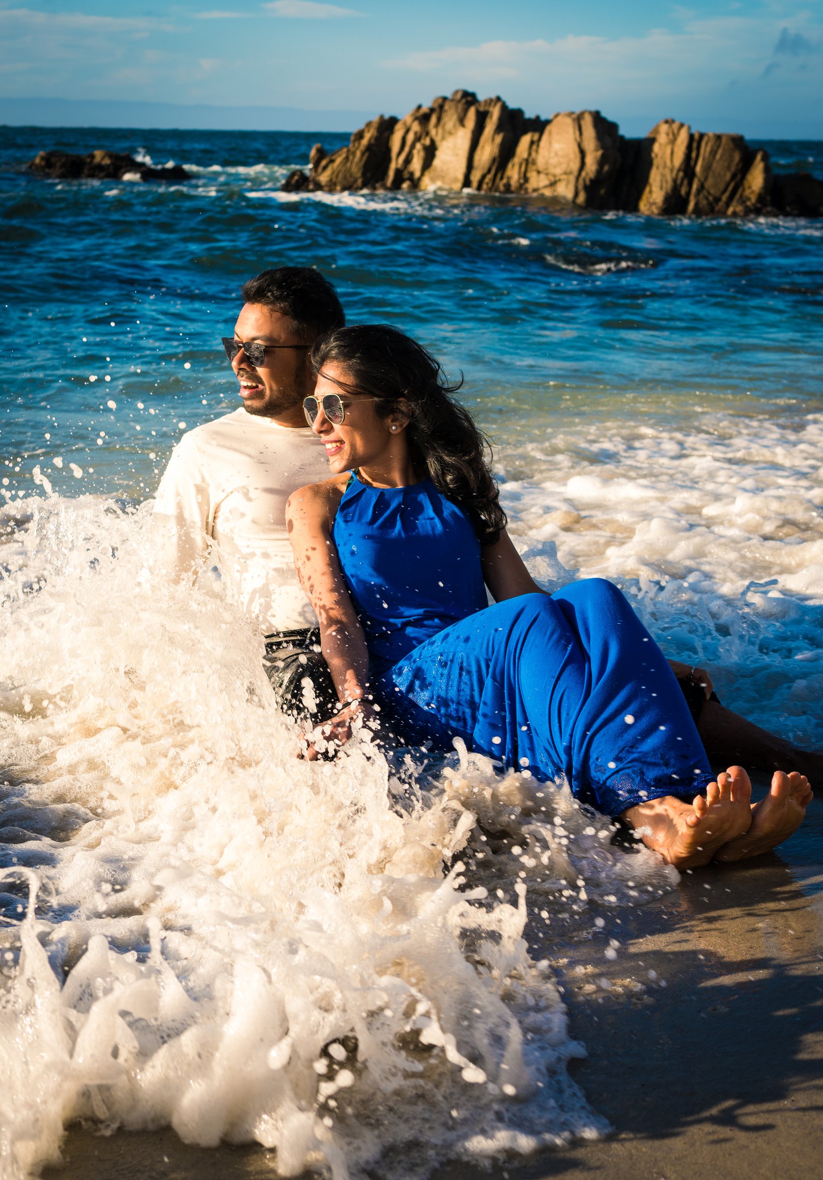 A wave breaking over a couple