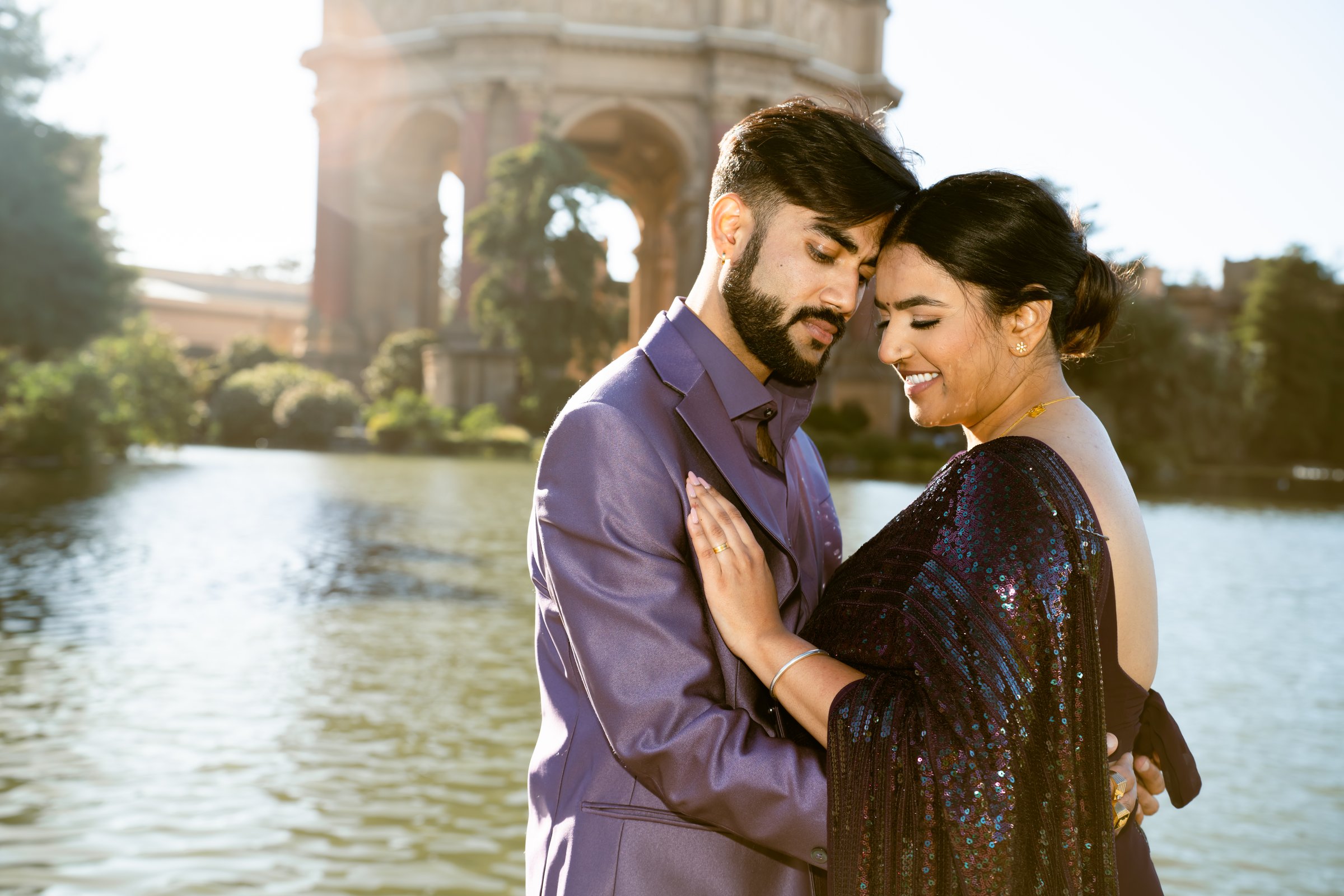 Triambika and varun's engagement shoot forehead touch by the lagoon