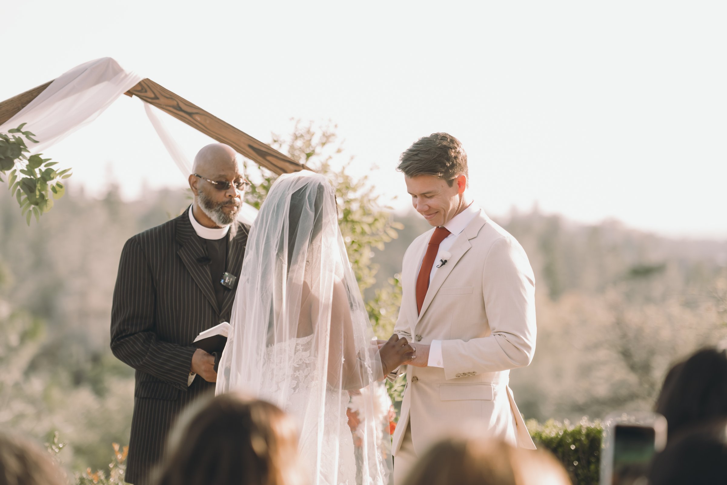 Ariel and devaughn's wedding backlit vows groom smiling