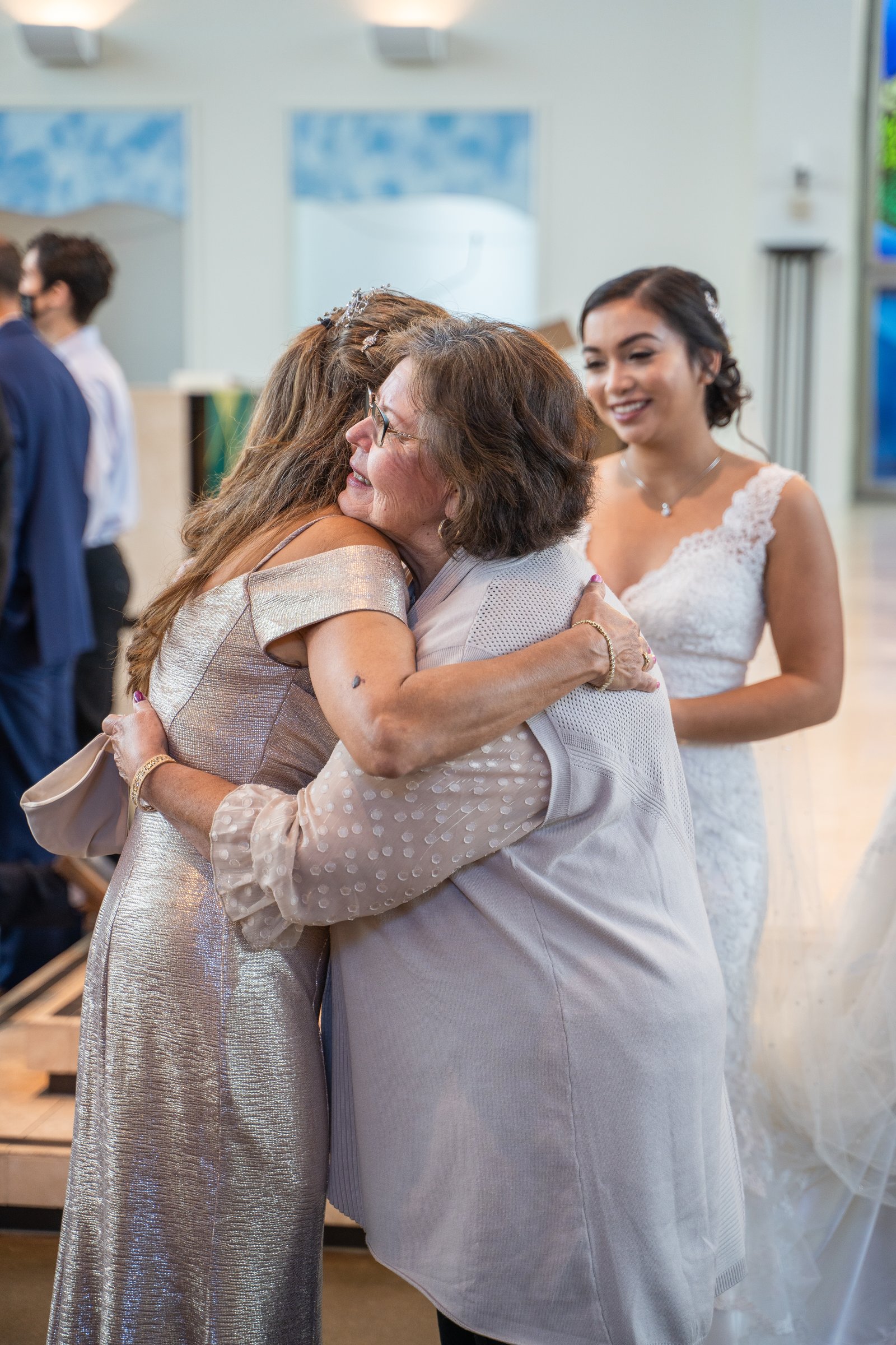 Vanessa and jimmy mothers embrace bride beaming